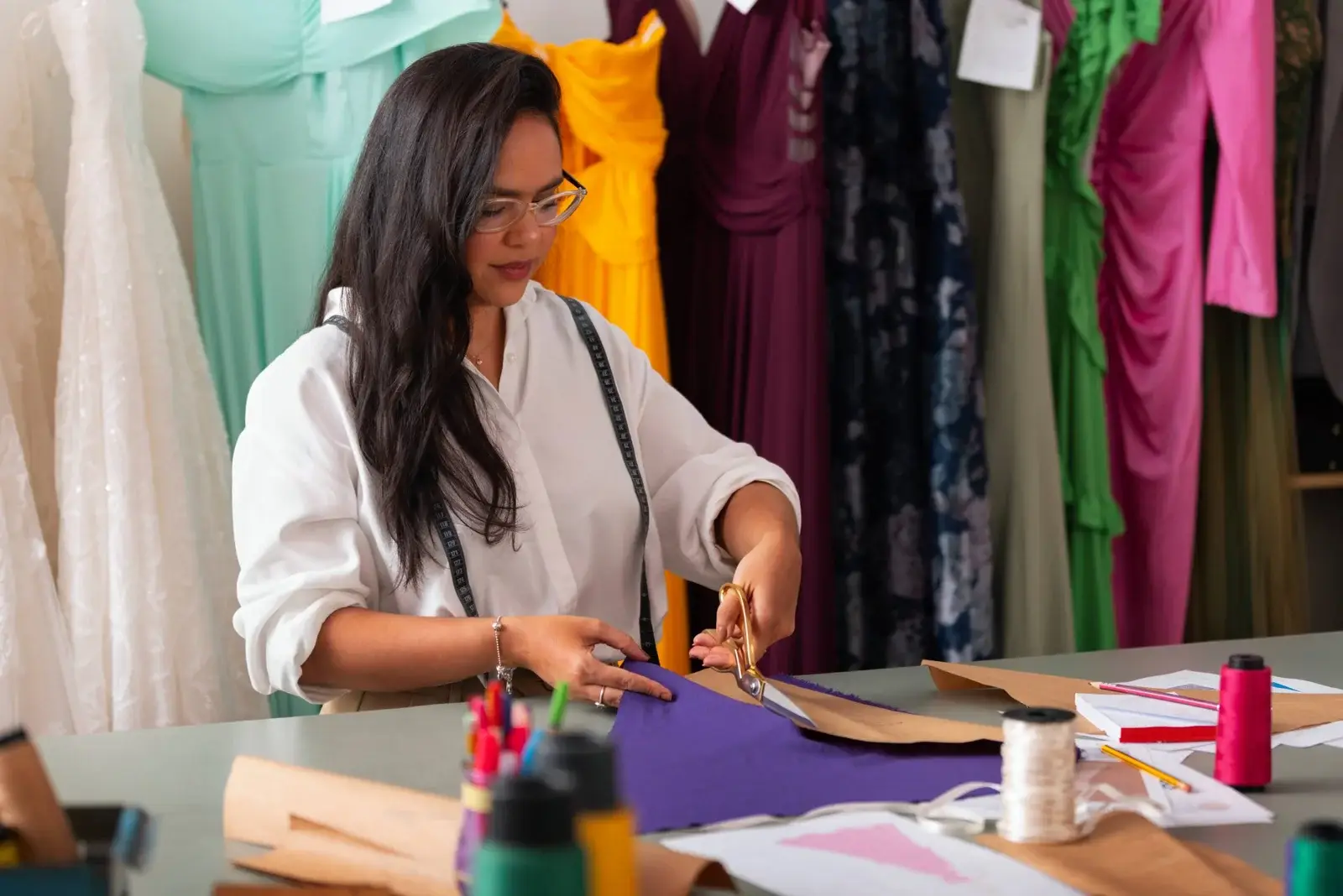 Fashion design students drafting apparel patterns during a practical training session at NIF Global