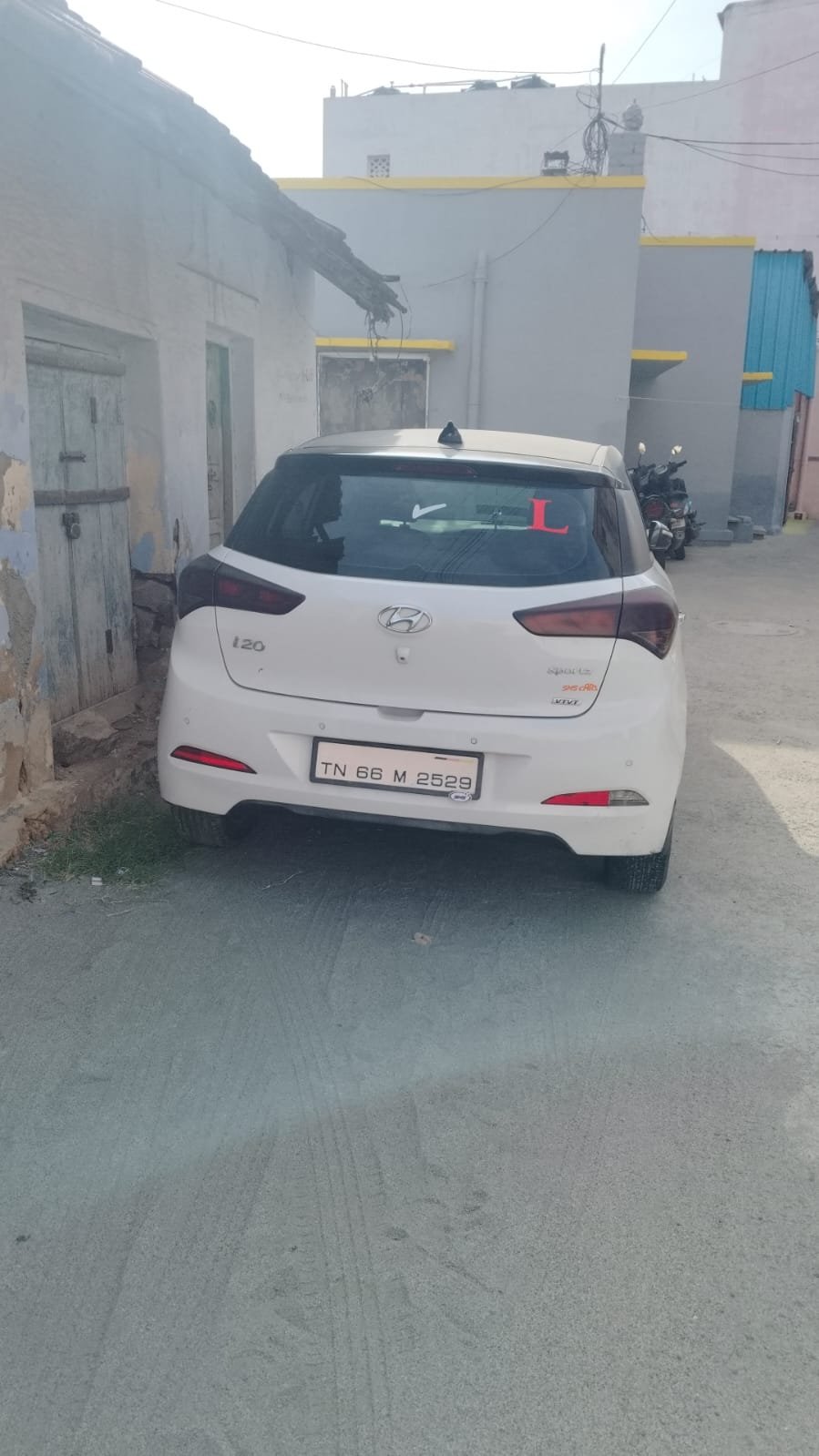A confident driver navigating city traffic during an advanced on-road upskilling session